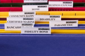 Different colored files displaying the different elements of disability insurance
